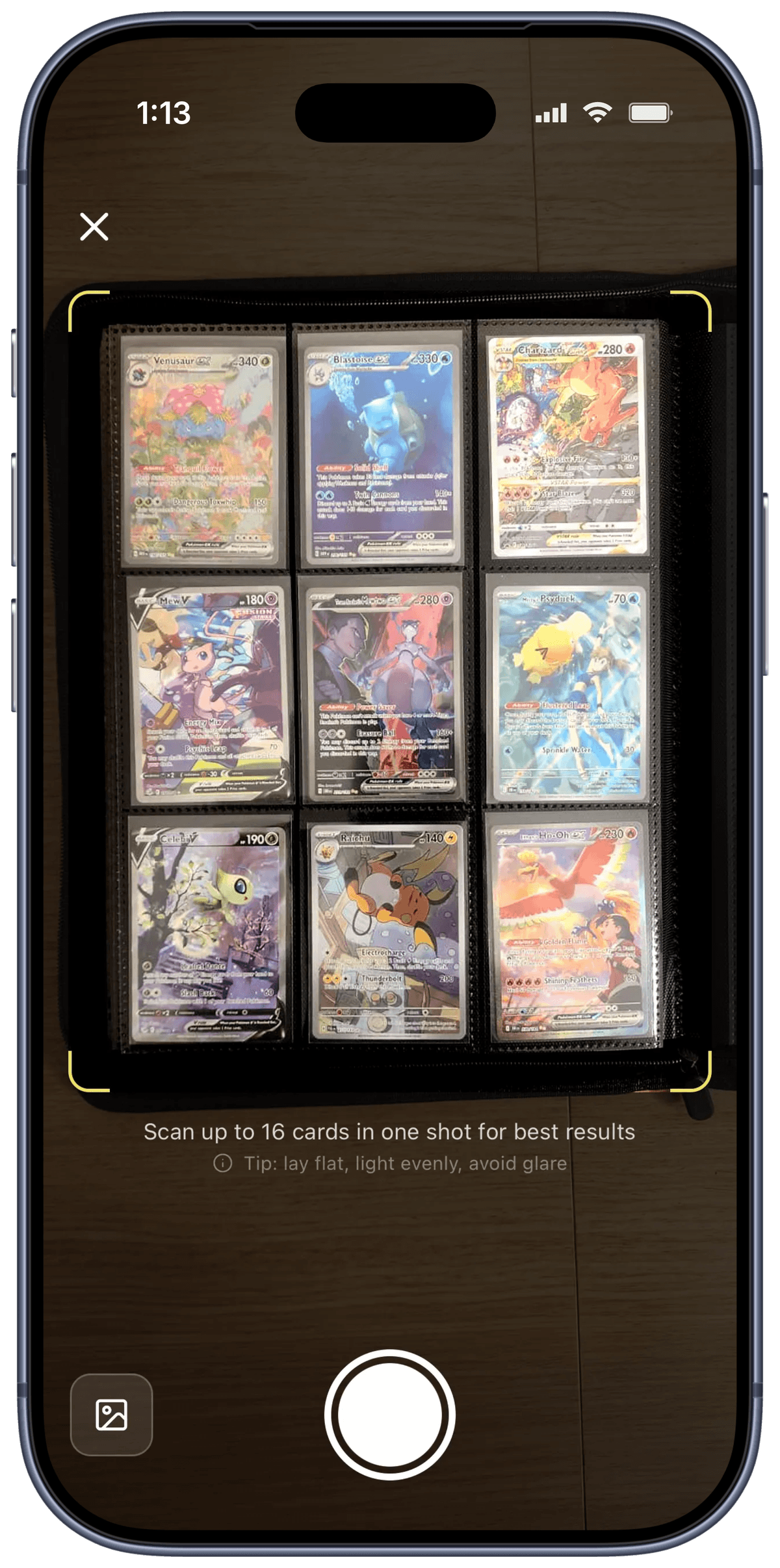 Rocketrader Scan view - camera scanning a binder page of nine Pokémon cards
